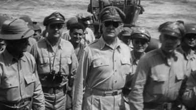 He swaggers onto the
sand without a helmet. - The Pacific War in Color