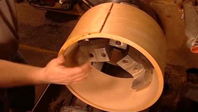 HE TURNS THE DRUM SHELL AROUND
TO CUT IT FROM ANOTHER ANGLE. - How It's Made