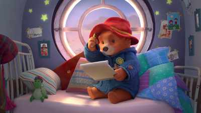 He was very pleased
to get his first Ranger badge, - The Adventures of Paddington