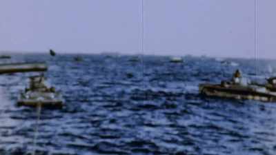 HEAVILY-ARMED AMPHIBIOUS
TANKS LEAD THE WAY - The Pacific War in Color