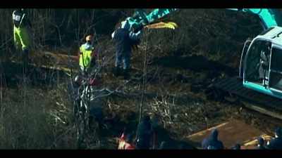 Heavy equipment, including a backhoe, - Lost Girls