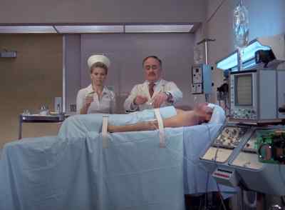 Help me strap him down, Jean. - The Six Million Dollar Man