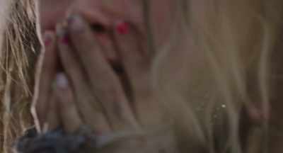 Her dark hair and pink sweater. - Tell It Like a Woman