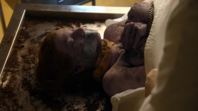 Her extremities have been
bound with clothing, like before. - CSI: Miami