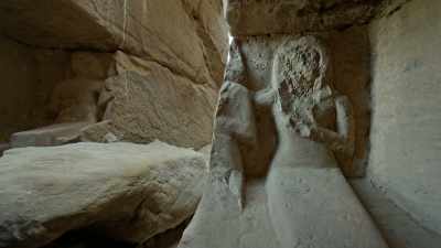 Here, a statue of
three seated figures - Ancient Armageddon