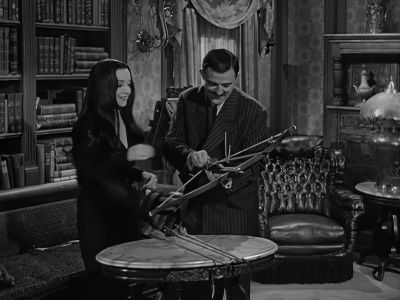 - Here you are, darling.
- Thank you, my dear. - The Addams Family