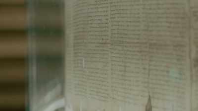 Here, behind a thick plate
of bulletproof glass, - God Code