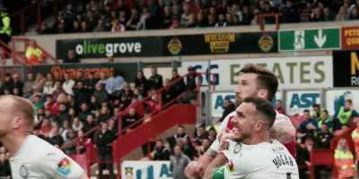 Here comes Tozer,
hurling it in under the bar. - Welcome to Wrexham