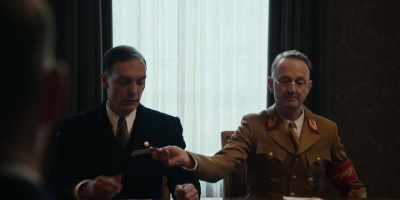 - Here, Gauleiter.
- Would you be so kind? - The Conference