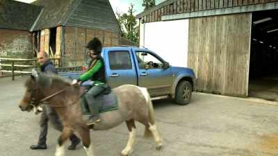 Here is Henry,
off for a ride on his pony. - Tractor Ted