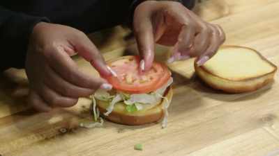 Here I'm going to use lettuce,
tomato, then my patty - No Recipe Road Trip With the Try Guys