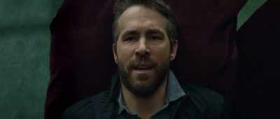 He's a hit man wanted for, like, - Hitman's Wife's Bodyguard