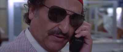 He's being met by a French agent
posing as a limo driver. - Son of the Pink Panther
