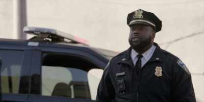He's fighting a suspect
for a gun in his right hand, - We Own This City