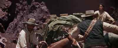 He's got it. Carrying gold. - The Wild Bunch