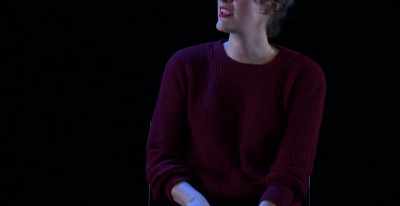 He's singing his song.
People are laughing and clapping. - Great British Theatre