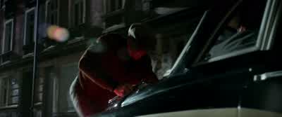 He's trying to stop the car. - The Man from U.N.C.L.E.