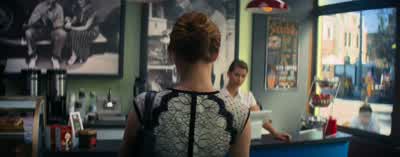 Hi. Could I have two iced coffees, please? - Right. Of course. - On us. Oh, no, thank you, I insist. - La La Land