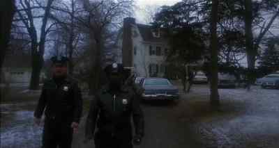 Hi. I'm their priest. He's with me. - Amityville II: The Possession