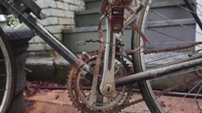 His bike is on display
on the front steps, - Shadow of a Wheel