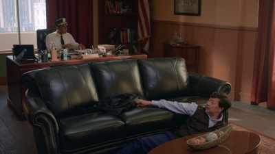 His jacket is on the couch.
Can you reach it? - Murderville