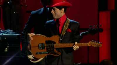...his powerhouse
guitar heroics - Let's Go Crazy: The Grammy Salute to Prince