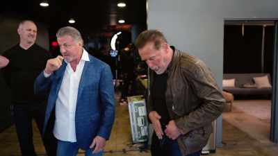 His shirt has something - Arnold & Sly: Rivals, Friends, Icons