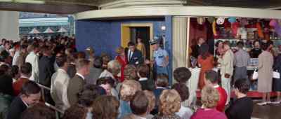Hold it, folks.
Back of the line. - It Happened at the World's Fair