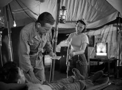 How we doing, soldier?
- Not... too bad, major. - Battle Circus