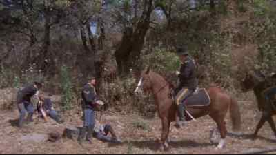 - How is he, Corporal?
- He's got a bad cut on his shoulder. - Rio Lobo
