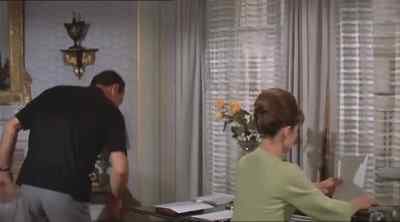 How the hell do I know?
Mysterious woman in black. - Paris When It Sizzles