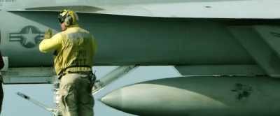 However, candidates must
still meet strict physical, - Top Gunner