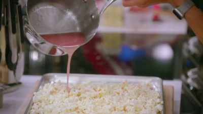 - I am pouring on corn syrup,
butter, and sugar. - Baking It