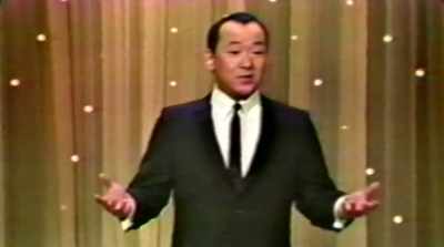 -I don't talk like that.
-[crowd laughs] - More Than Miyagi: The Pat Morita Story