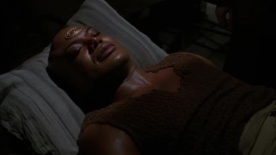 I don't understand. His condition's
getting worse. Let me check his wound. - Stargate SG-1