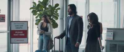 - I hope our flight's on time.
- Oh, it is. See? - Destination Wedding