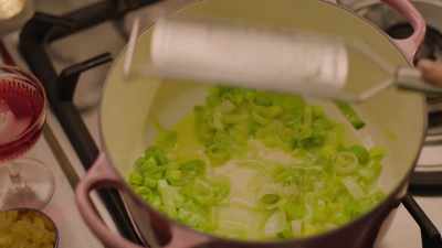I mince in some garlic now. - Nigella: At My Table