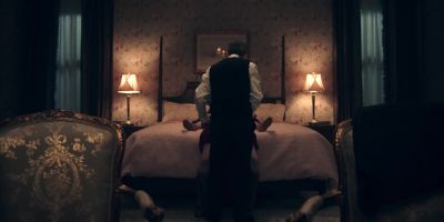 One describes. - The Handmaid's Tale