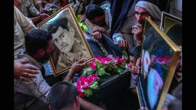 I photographed
the people mourning, - Photographer
