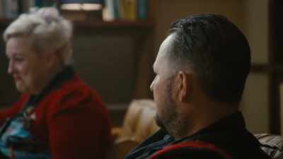 I read it as...
Doug doesn't care, - Couples Therapy