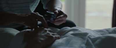 I sat on his bed staring at his chest, - This England