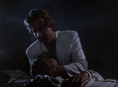[Woman Over P.A.]
Dr. Baker to Surgery, please. - Miami Vice