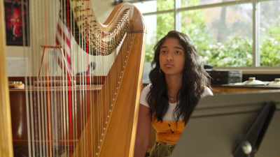 I'd like to welcome back Devi V,
our star harpist. - Never Have I Ever