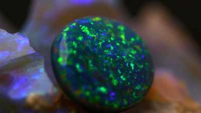 Identified by its black body tone. - Outback Opal Hunters