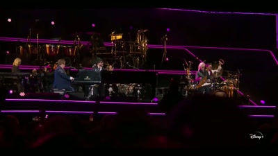 ♪ I'm a bitch, I'm a bitch
oh, the bitch is back ♪ - Elton John Live: Farewell from Dodger Stadium