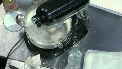 I'm adding more powdered sugar
to get a stronger consistency. - Halloween Cookie Challenge