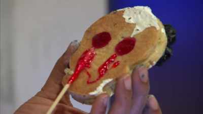 I'm sticking on some isomalt
as glue for my lights. - Halloween Cookie Challenge