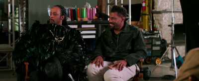 In a crow suit
with gold chains - 2 Minutes of Fame
