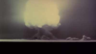 IN AN INSTANT, HUMANITY ENTERS
THE NUCLEAR AGE. - America in Color