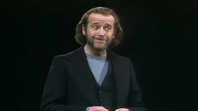 -In baseball, you wear a cap.
-(AUDIENCE LAUGHING) - George Carlin's American Dream